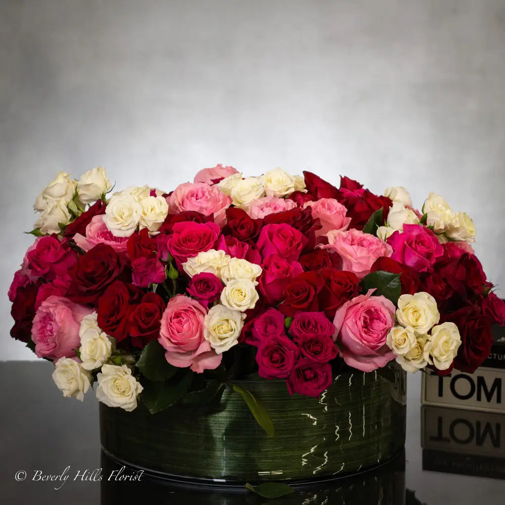 100 Blooms of Love in a glass vase with white, pink, and red fresh flowers, same-day delivery by LA Orchidia.