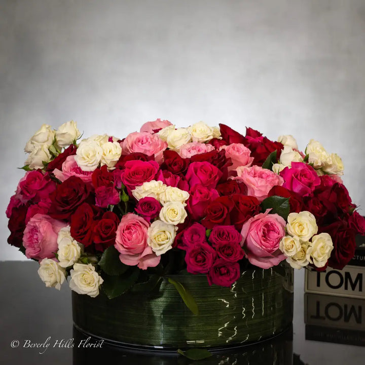 100 Blooms of Love in a glass vase with white, pink, and red fresh flowers, same-day delivery by LA Orchidia.