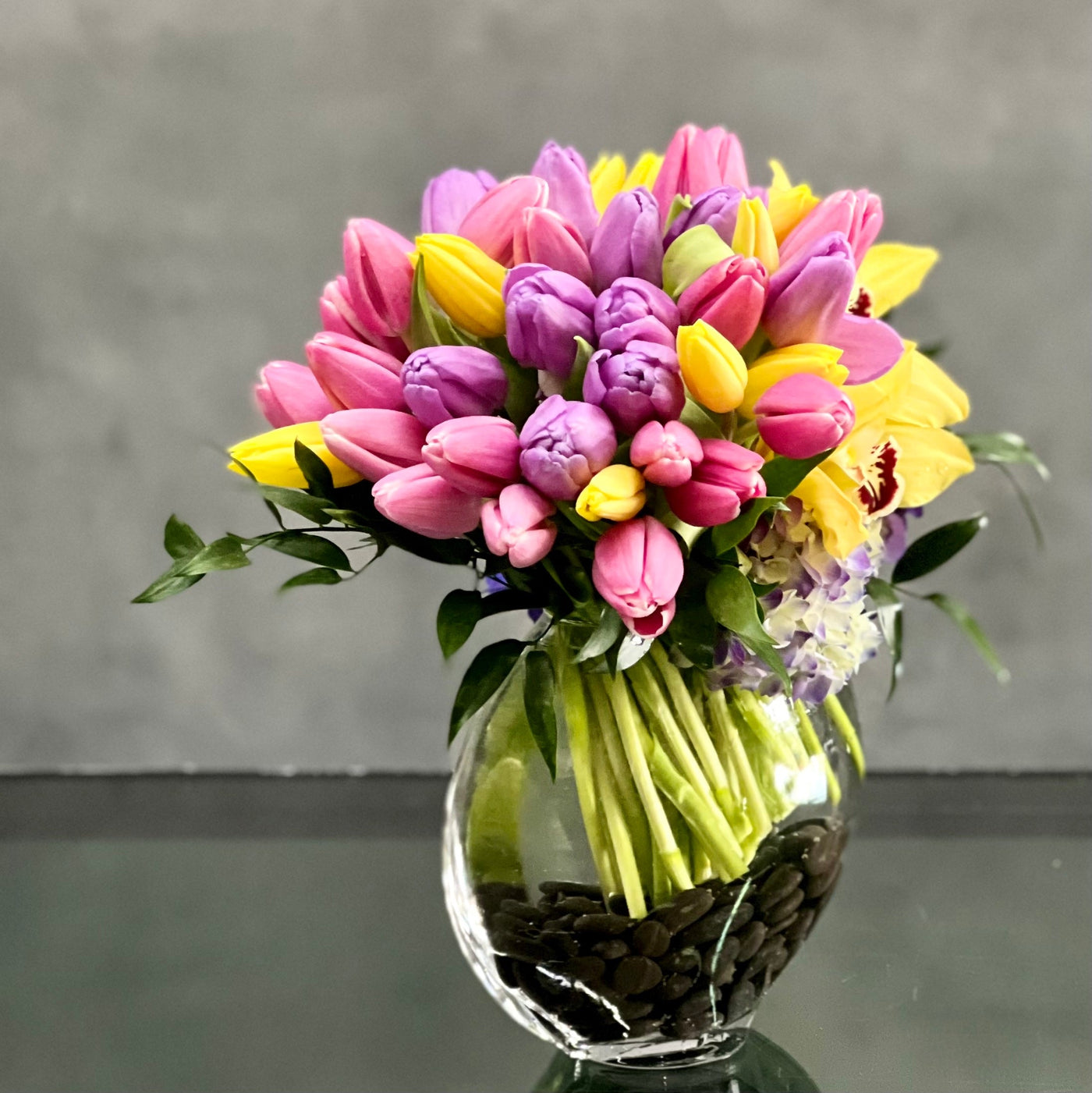 Here's a spring-tastic way to brighten someone's day from Santa Monica Florist. With our same day delivery arrangement placed in a glass vase of beautiful Tulips, Orchids and Hydrangeas, it makes a delightful decoration for a table, or any corner of the home office that could use a little magic.