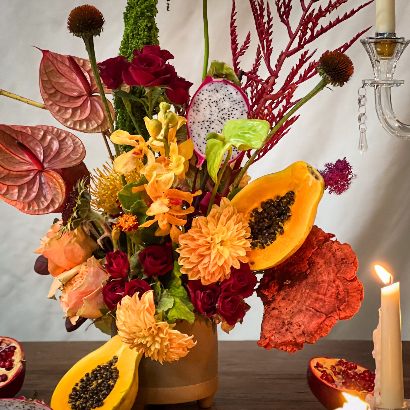 Lush arrangement of amaranths, anthuriums, and vibrant papayas in a white vase – Elegant Blooming Beauty, available for same-day delivery by Santa Monica Florist.