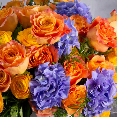 The Tale of Orange Roses and Blue Hydrangeas Arrangement
Luxury Orange Garden Roses and Blue Hydrangeas in White Vase
Sunburst Floral Arrangement for Same-Day Delivery Santa Monica
Vibrant Orange and Blue Floral Arrangement Los Angeles Delivery