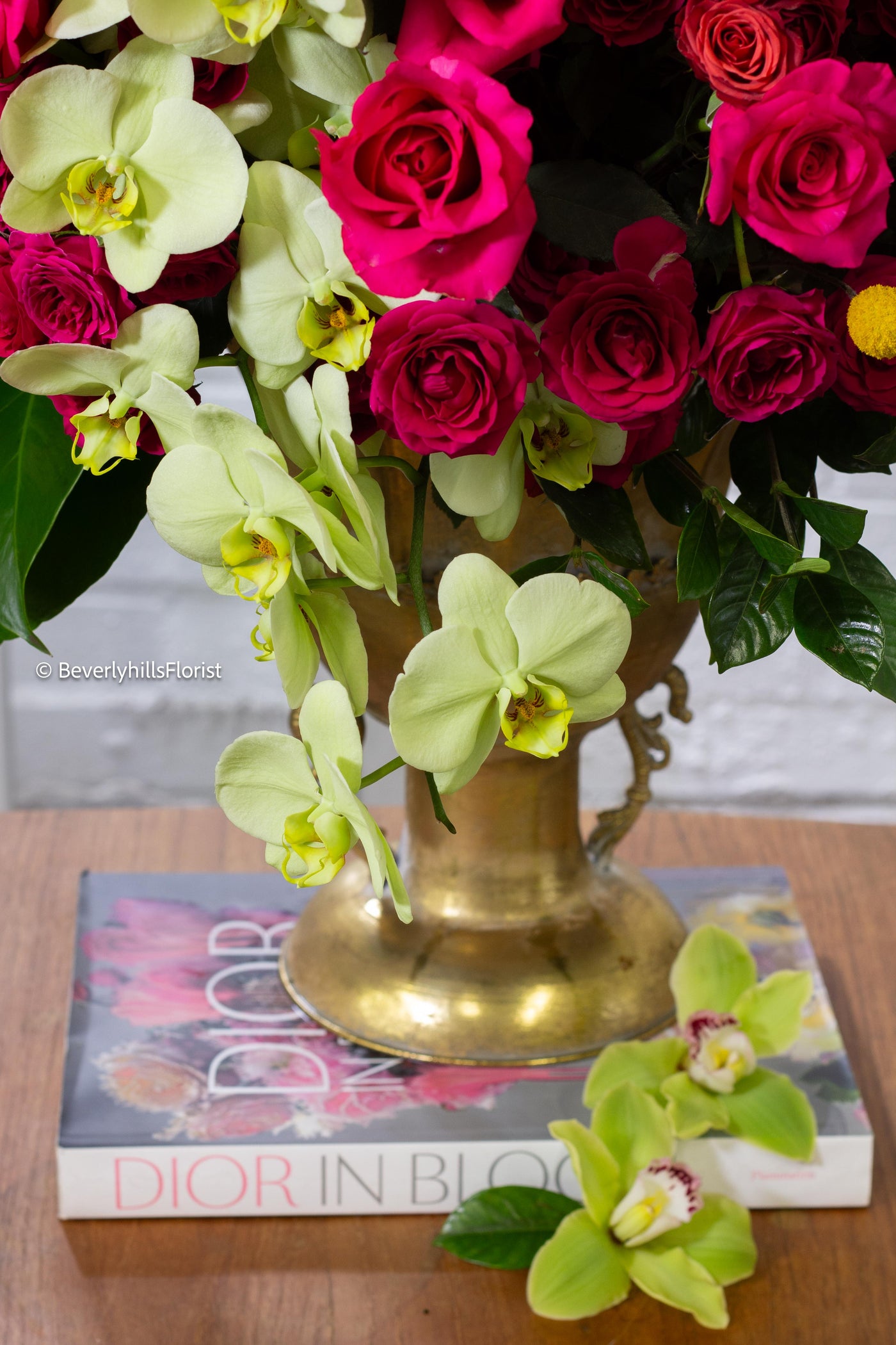 Amore Roses arrangement with red, pink, and cream roses, orchids, and spray roses in a golden pedestal container, available for same-day delivery by Santa Monica Florist.