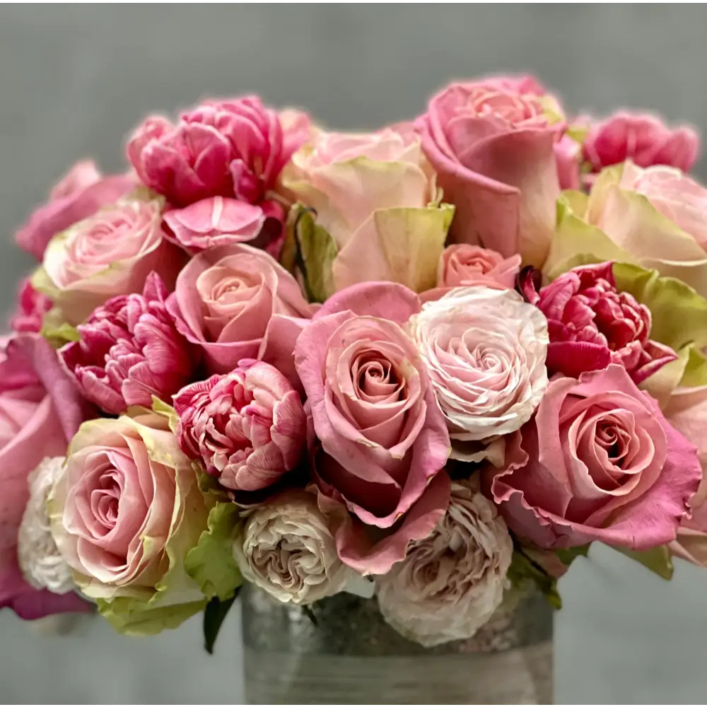 Amour arrangement with pink roses and tulips in a silver-textured vase, perfect for love and romance, available for same-day delivery by LA Orchidia.
