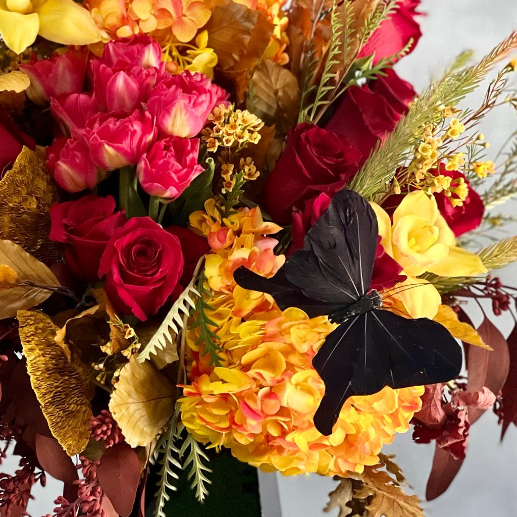 Autumn Sonata arrangement with local hydrangeas, South American roses, and Asian orchids in vibrant fall colors, available for same-day delivery by Santa Monica Florist.