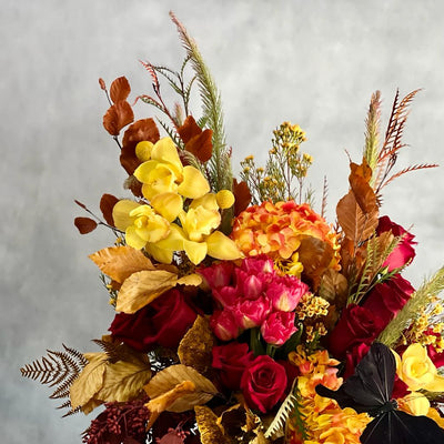 Autumn Sonata arrangement with local hydrangeas, South American roses, and Asian orchids in vibrant fall colors, available for same-day delivery by Santa Monica Florist.