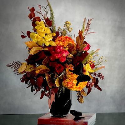 Autumn Sonata arrangement with local hydrangeas, South American roses, and Asian orchids in vibrant fall colors, available for same-day delivery by Santa Monica Florist.