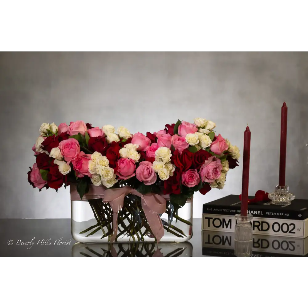 Luxury heart-shaped rose arrangement with over 100 premium red roses in a glass vase, available for same-day delivery in Los Angeles and Los Angeles.