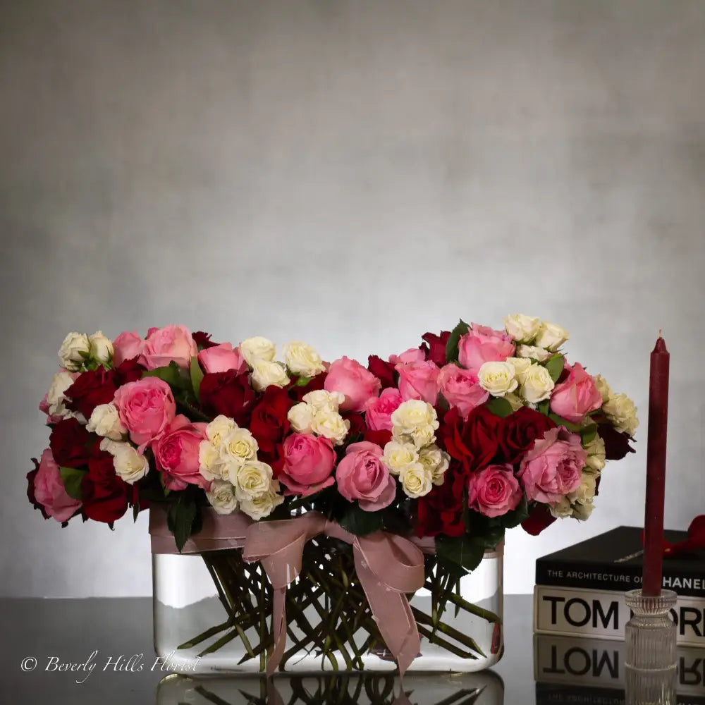 Luxury heart-shaped rose arrangement with over 100 premium red roses in a glass vase, available for same-day delivery in Los Angeles and Los Angeles.