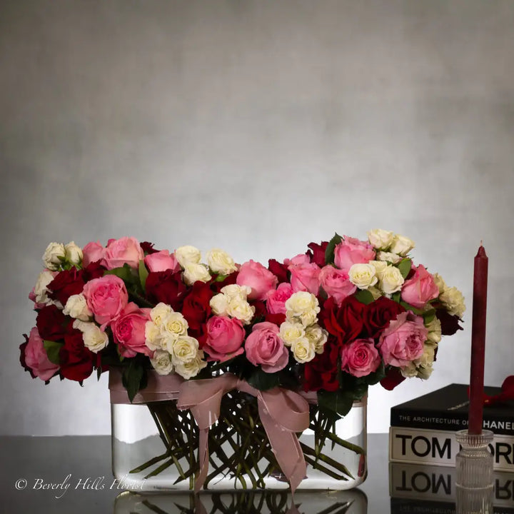Luxury heart-shaped rose arrangement with over 100 premium red roses in a glass vase, available for same-day delivery in Los Angeles and Los Angeles.