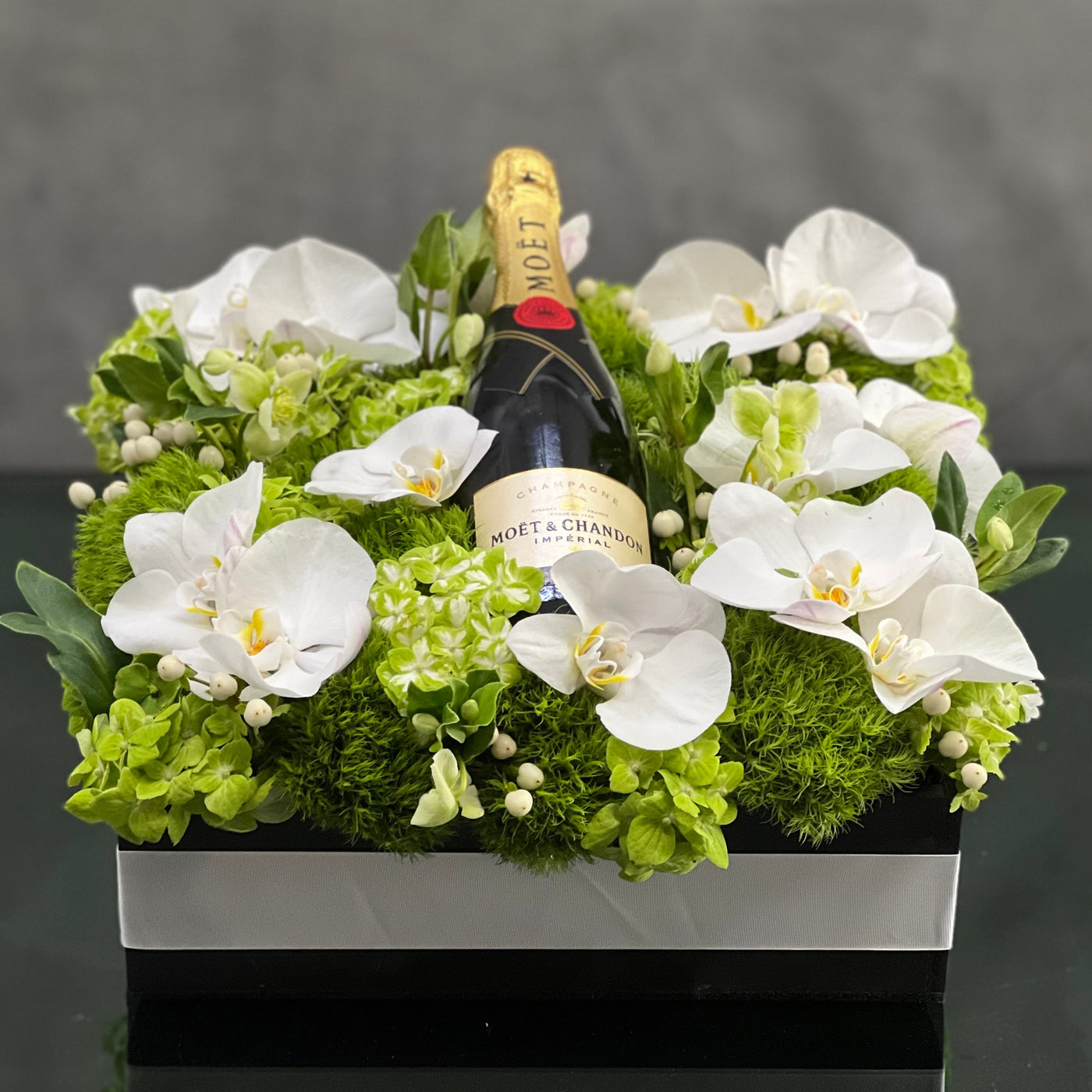 Santa Monica Florist presents this luxury Moet floral box with orchids and other locally sourced flowers. 24 inch square box. for same day delivery !