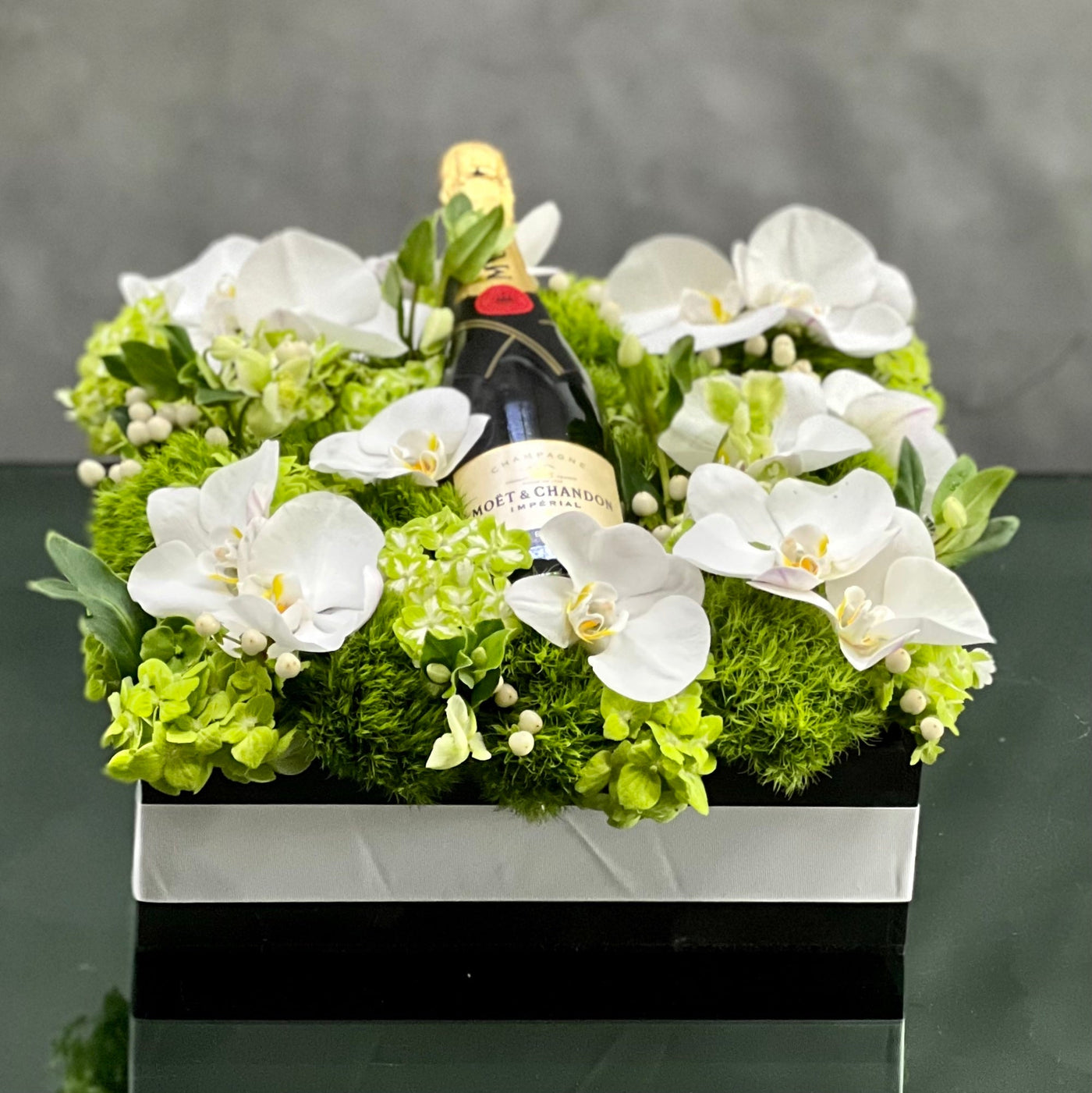 Santa Monica Florist presents this luxury Moet floral box with orchids and other locally sourced flowers. 24 inch square box