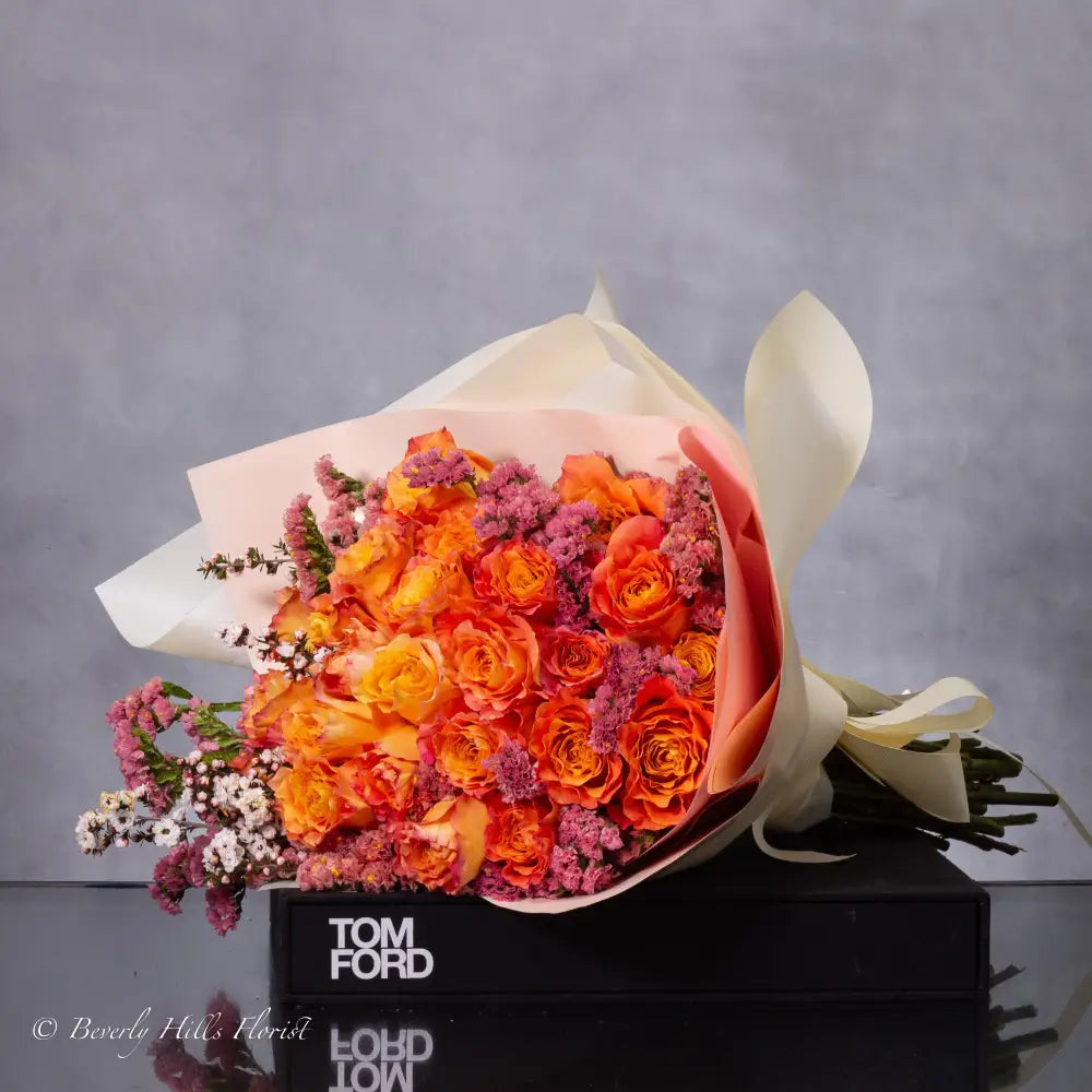 Orange Two-Tone Fragrant Rose Hand Bouquet with vibrant orange hues and delicate fragrance for same-day delivery in Los Angeles.