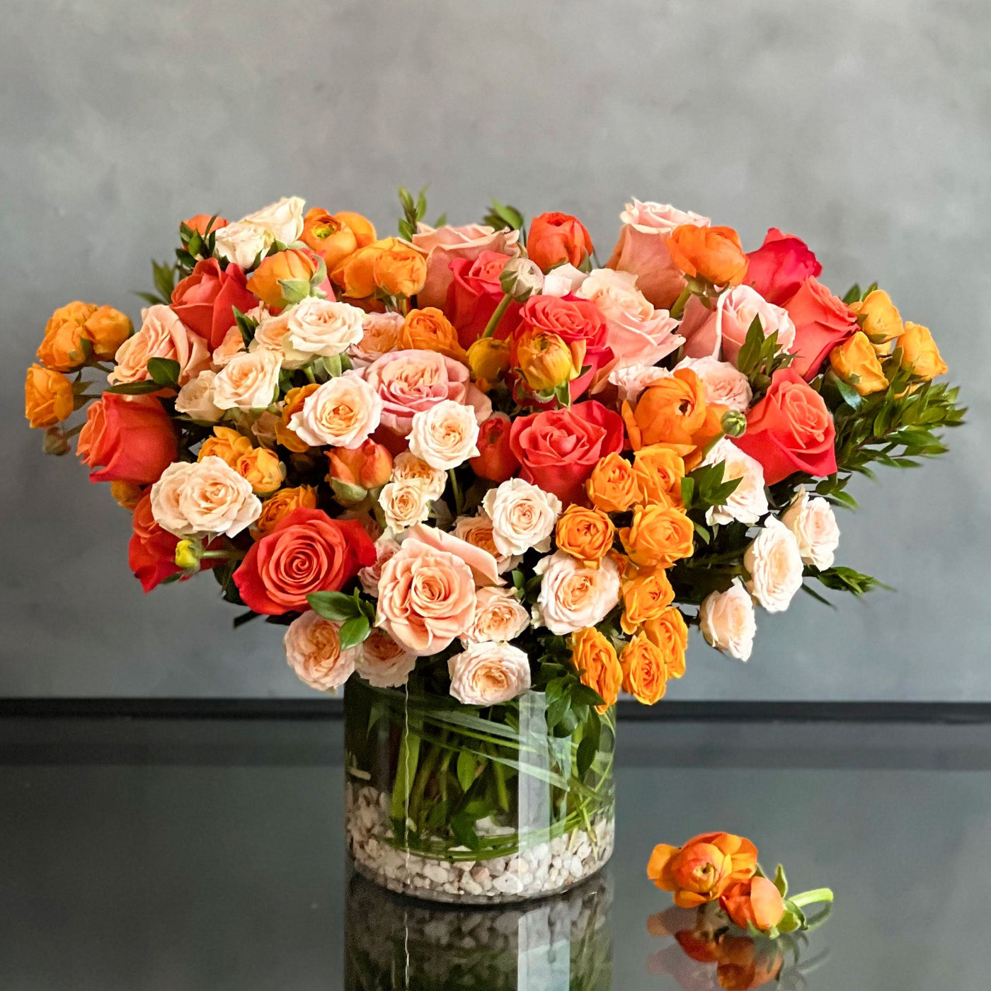 Peachy Sunset Floral Arrangement with Orange Roses and Peach Spray Roses
Elegant Ranunculus and Rose Arrangement in Glass Vase
Luxury Floral Arrangement for Same-Day Delivery Santa Monica
Peachy Sunset Flower Arrangement for Los Angeles Delivery