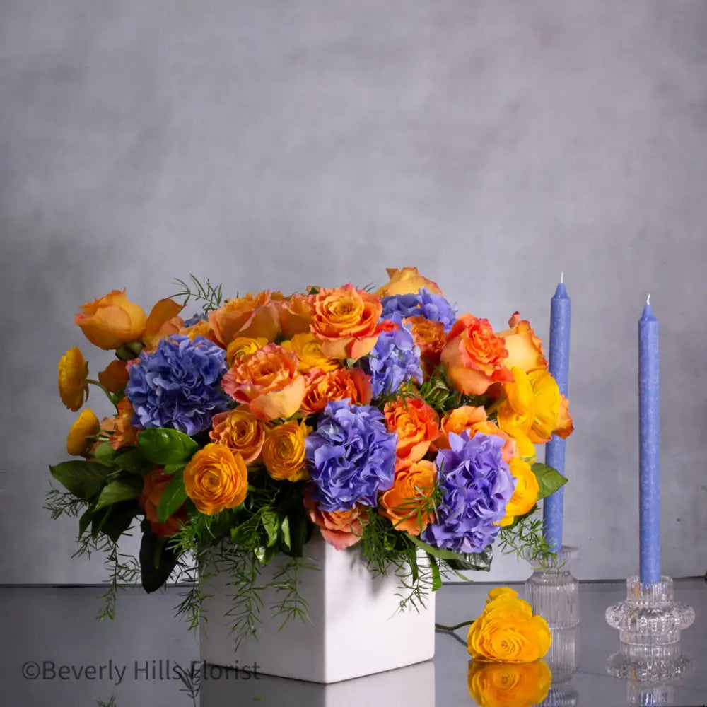 The Tale of Orange Roses and blue hydrangeas